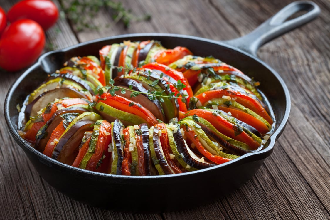 Traditional homemade vegetable ratatouille baked in cast iron frying pan